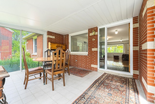 10827 N 12th St, Plainwell, MI 49080 - sunroom / solarium featuring outdoor dining space