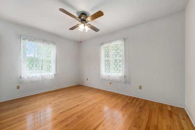 10827 N 12th St, Plainwell, MI 49080 - spare room featuring plenty of natural light, light wood-style flooring, and baseboards