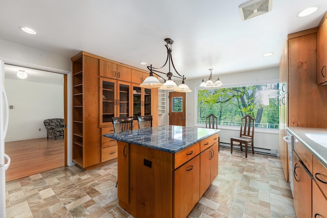 10827 N 12th St, Plainwell, MI 49080 - kitchen featuring a baseboard radiator, a center island, light stone finish flooring, brown cabinetry, and recessed lighting