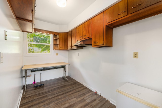 10827 N 12th St, Plainwell, MI 49080 - laundry area featuring dark wood finished floors and baseboards
