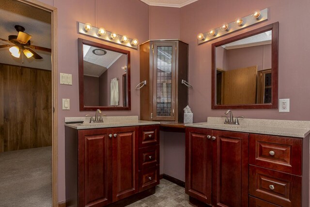 10303 Walnut Dr, Three Rivers, MI 49093 - full bathroom with two vanities, a ceiling fan, and crown molding