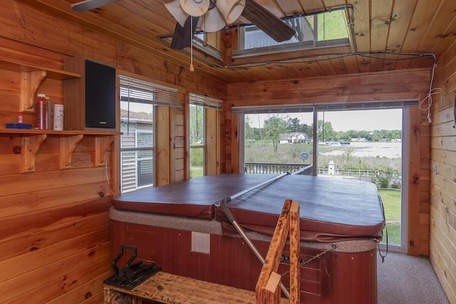 10303 Walnut Dr, Three Rivers, MI 49093 - carpeted dining space featuring wood walls, a ceiling fan, and wood ceiling