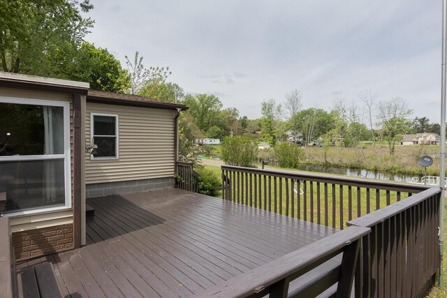 10303 Walnut Dr, Three Rivers, MI 49093 - wooden deck with a water view and a yard