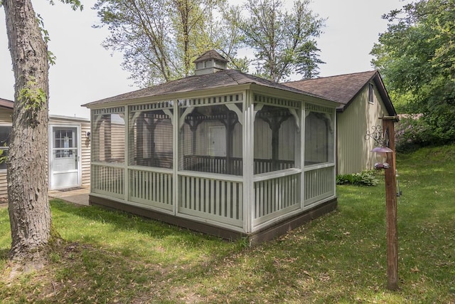 10303 Walnut Dr, Three Rivers, MI 49093 - rear view of house with a gazebo, a lawn, a shingled roof, and a chimney