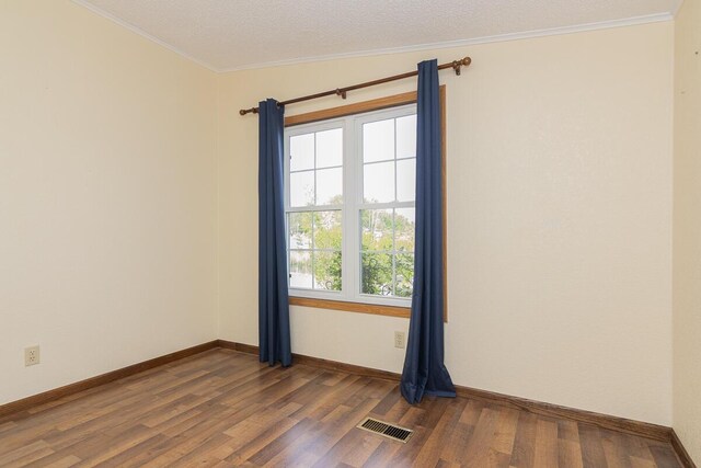 10303 Walnut Dr, Three Rivers, MI 49093 - spare room with dark wood-style floors, crown molding, and baseboards