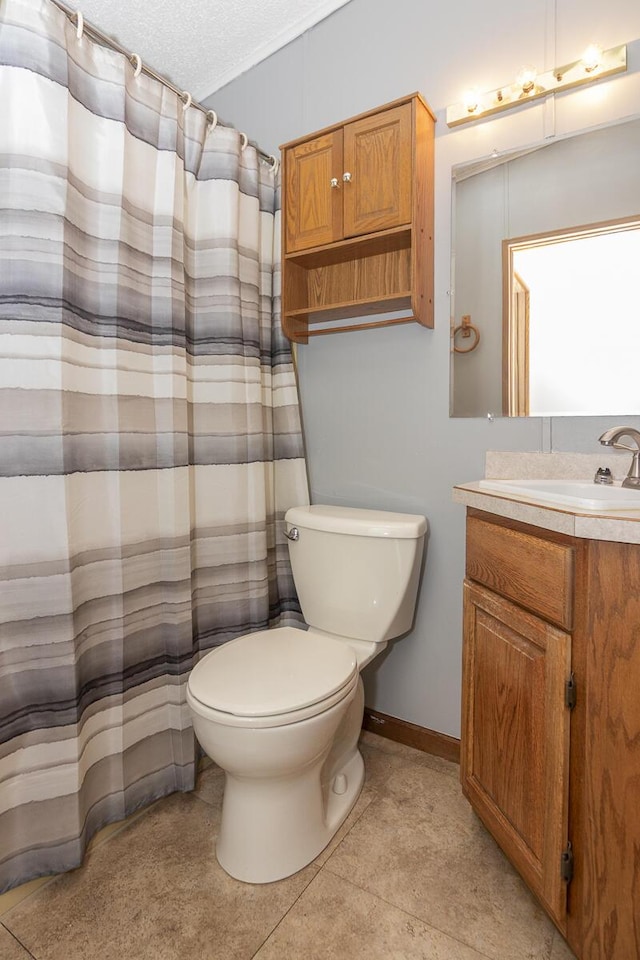 10303 Walnut Dr, Three Rivers, MI 49093 - full bath featuring toilet, vanity, a textured ceiling, curtained shower, and baseboards