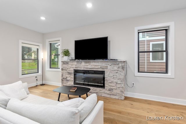 633 Fairview Ave NE Unit 2, Grand Rapids, MI 49503 - living area featuring baseboards, wood finished floors, a fireplace, and recessed lighting