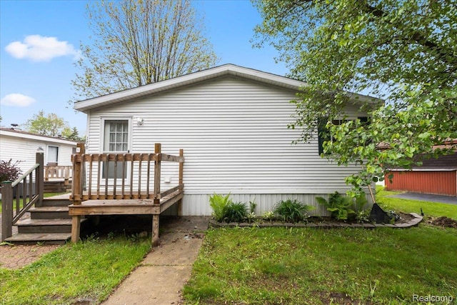 351 N Squirrel Rd, Auburn Hills, MI 48326 - view of side of property featuring a wooden deck and a lawn