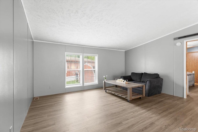 351 N Squirrel Rd, Auburn Hills, MI 48326 - living area featuring wood finished floors and a textured ceiling