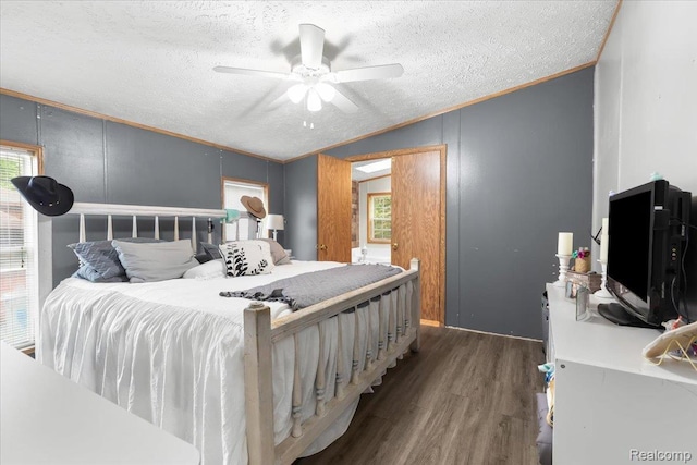 351 N Squirrel Rd, Auburn Hills, MI 48326 - bedroom featuring wood finished floors, a textured ceiling, vaulted ceiling, ornamental molding, and a ceiling fan