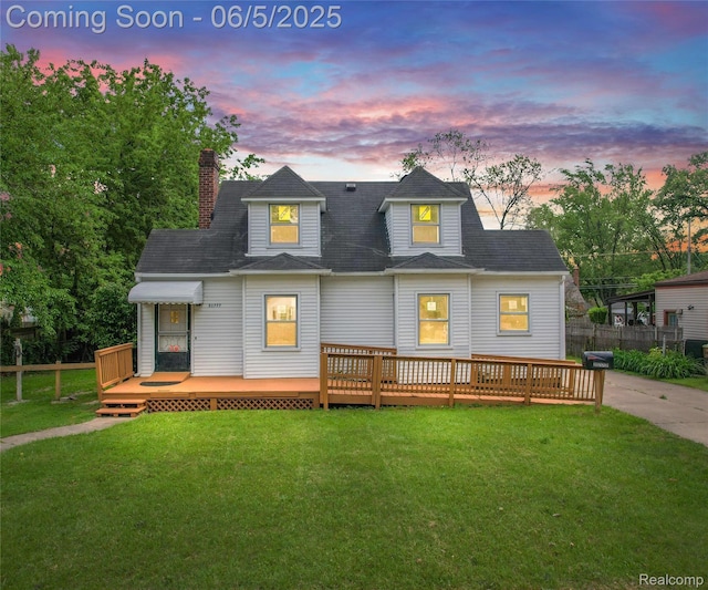 31777 Hennepin St, Garden City, MI 48135 - rear view of house with a wooden deck and a chimney