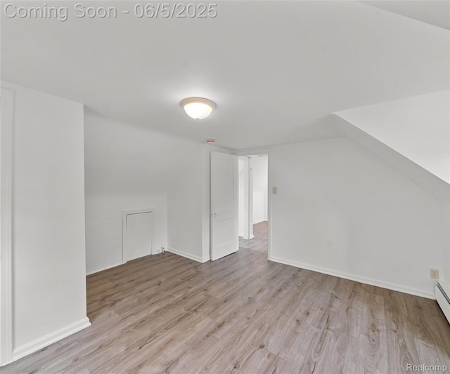 31777 Hennepin St, Garden City, MI 48135 - bonus room with wood finished floors, baseboards, baseboard heating, and lofted ceiling