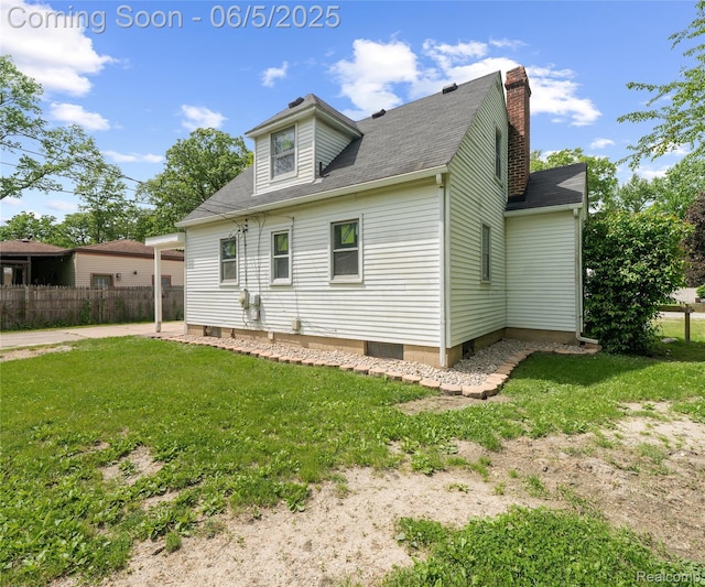 31777 Hennepin St, Garden City, MI 48135 - rear view of property featuring a chimney and a shingled roof