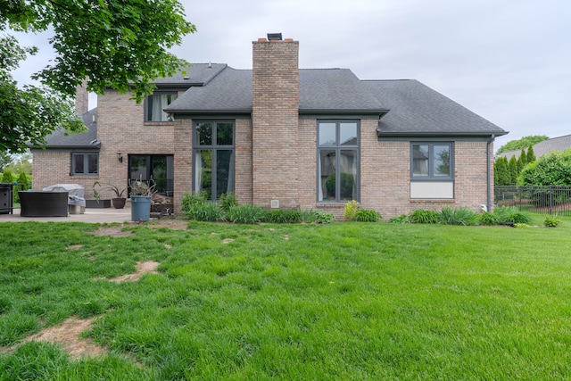 14607 Stratford, Shelby Twp, MI 48315 - rear view of house with a chimney, brick siding, and roof with shingles
