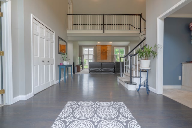 14607 Stratford, Shelby Twp, MI 48315 - foyer entrance featuring wood finished floors, stairway, a high ceiling, and baseboards