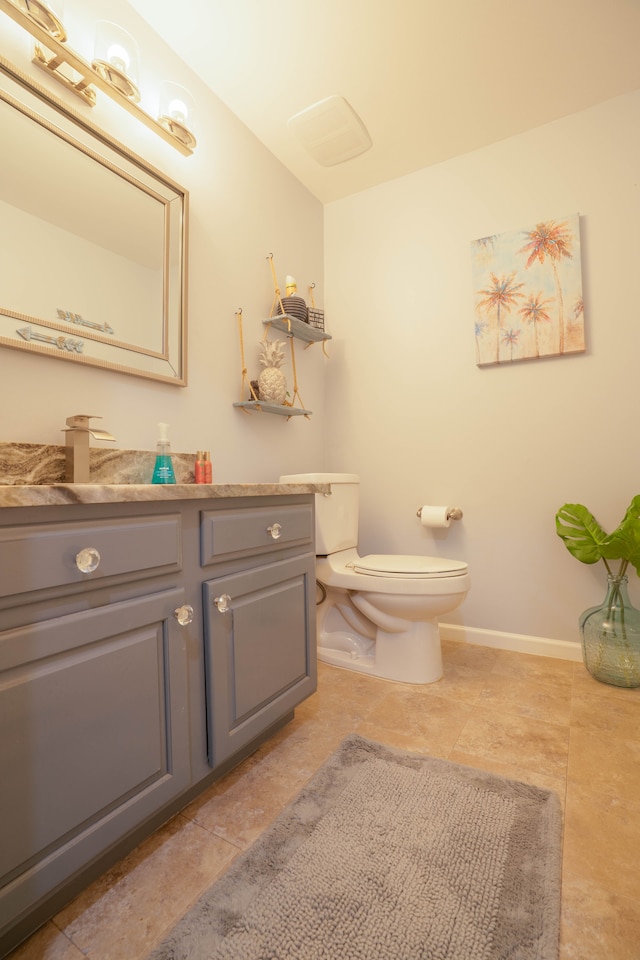 14607 Stratford, Shelby Twp, MI 48315 - half bathroom with vanity, toilet, and baseboards