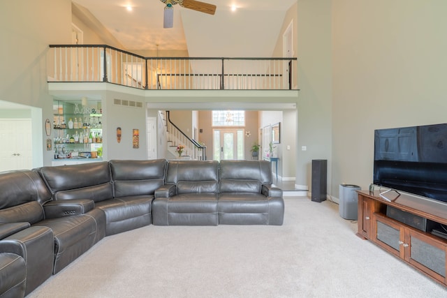 14607 Stratford, Shelby Twp, MI 48315 - carpeted living area with a towering ceiling, a ceiling fan, stairs, and baseboards