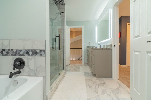 14607 Stratford, Shelby Twp, MI 48315 - bathroom with a stall shower, vanity, a garden tub, and marble look tiles