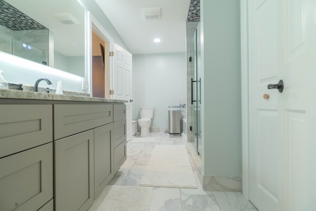 14607 Stratford, Shelby Twp, MI 48315 - bathroom with marble finish flooring, vanity, a stall shower, toilet, and baseboards