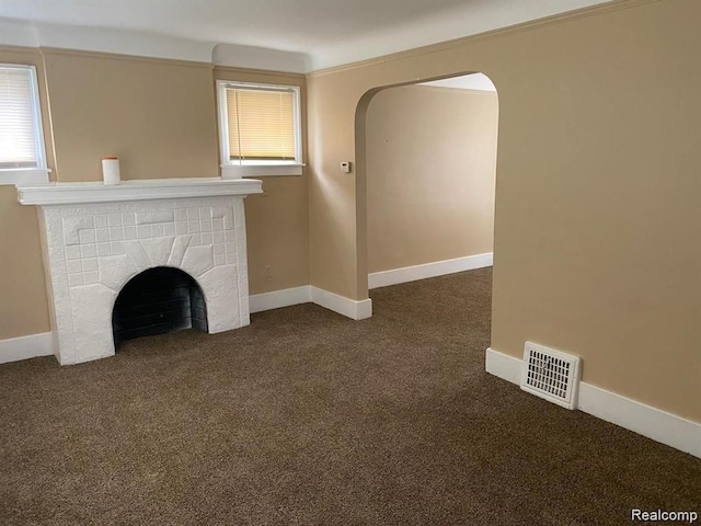 9966 Hartwell St, Detroit, MI 48227 - unfurnished living room featuring dark carpet, a tile fireplace, and baseboards