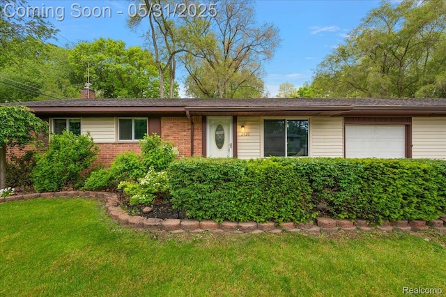 2920 Pinto Dr, Commerce Twp, MI 48382 - single story home featuring a front lawn, brick siding, and an attached garage