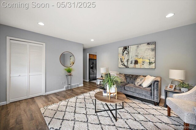 2920 Pinto Dr, Commerce Twp, MI 48382 - living room featuring wood finished floors, recessed lighting, and baseboards