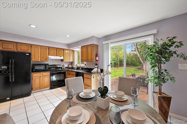 2920 Pinto Dr, Commerce Twp, MI 48382 - kitchen featuring black appliances, under cabinet range hood, a sink, dark countertops, and light tile patterned floors