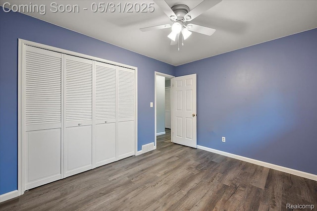 2920 Pinto Dr, Commerce Twp, MI 48382 - unfurnished bedroom with wood finished floors, baseboards, a closet, and a ceiling fan