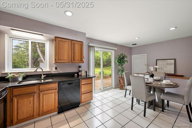 2920 Pinto Dr, Commerce Twp, MI 48382 - kitchen with black appliances, a sink, brown cabinets, dark countertops, and recessed lighting