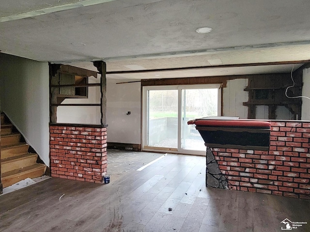 8255 Secor Rd, Lambertville, MI 48144 - unfurnished living room with hardwood / wood-style floors and stairs