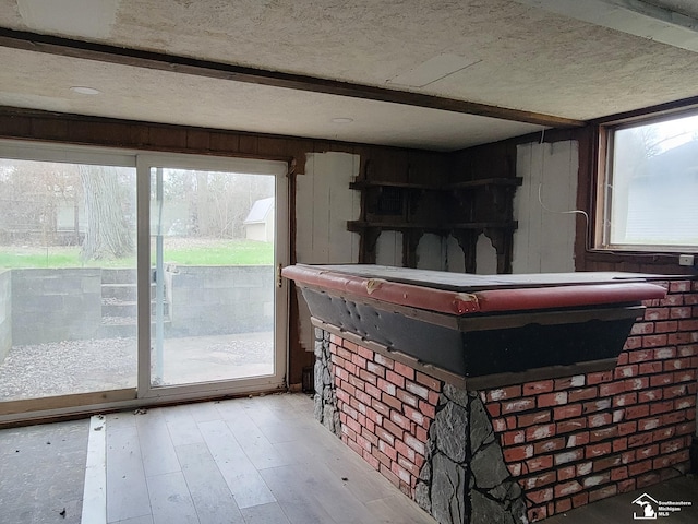 8255 Secor Rd, Lambertville, MI 48144 - bar area featuring a textured ceiling and light wood-style floors