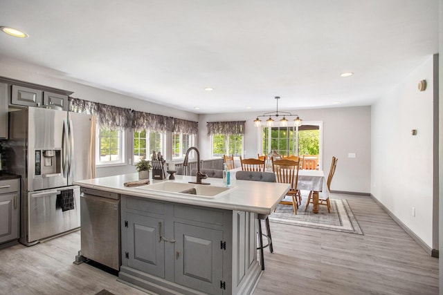 1134 Oak Grove Park, Union City, MI 49094 - kitchen featuring stainless steel appliances, a sink, gray cabinetry, a center island with sink, and recessed lighting