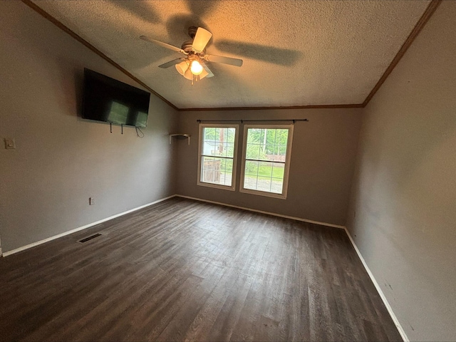 815 Hyatt St, Eaton Rapids, MI 48827 - unfurnished room with a textured ceiling, dark wood-style floors, lofted ceiling, ceiling fan, and ornamental molding