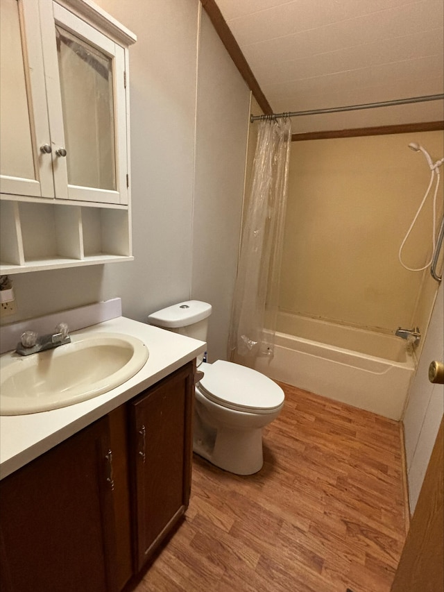 815 Hyatt St, Eaton Rapids, MI 48827 - bathroom featuring wood finished floors, vanity, shower / bath combo with shower curtain, and toilet