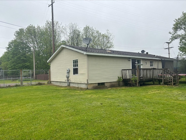 815 Hyatt St, Eaton Rapids, MI 48827 - rear view of house featuring a wooden deck