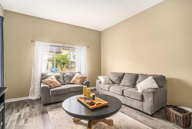201 Page St NE, Grand Rapids, MI 49505 - living area featuring dark wood finished floors and baseboards