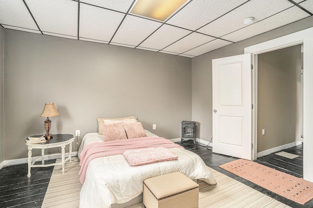 201 Page St NE, Grand Rapids, MI 49505 - bedroom featuring wood finished floors, baseboards, and a drop ceiling