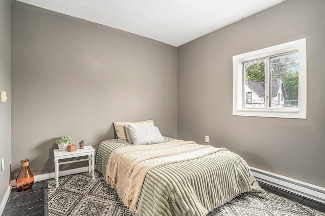 201 Page St NE, Grand Rapids, MI 49505 - bedroom with baseboard heating and baseboards