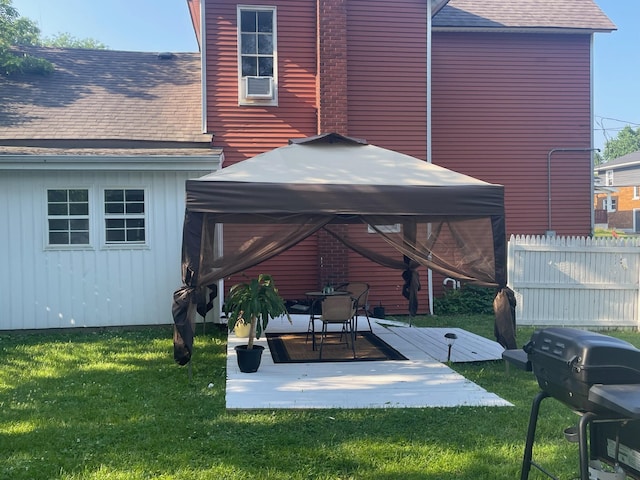 201 Page St NE, Grand Rapids, MI 49505 - back of house featuring a gazebo, a shingled roof, board and batten siding, a patio, and cooling unit