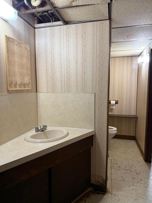 3104 Chippewa Hwy, Manistee, MI 49660 - bathroom featuring vanity, toilet, and tile patterned floors