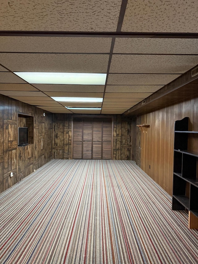 3104 Chippewa Hwy, Manistee, MI 49660 - finished basement featuring wood walls and carpet flooring
