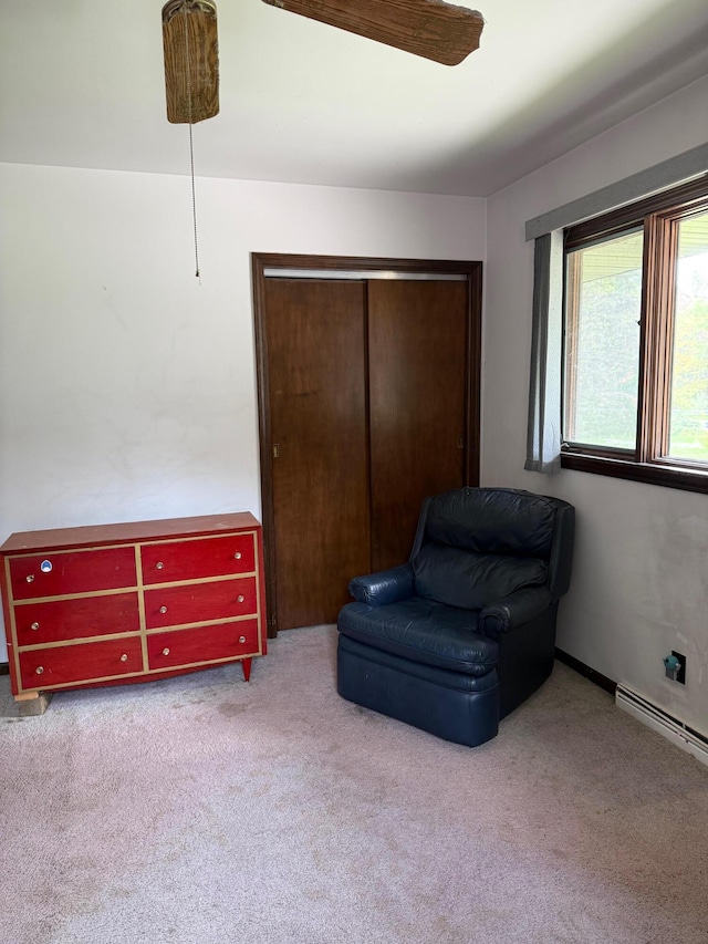 3104 Chippewa Hwy, Manistee, MI 49660 - living area featuring carpet flooring and ceiling fan