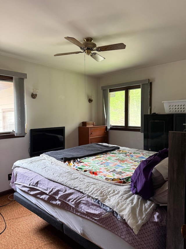 3104 Chippewa Hwy, Manistee, MI 49660 - carpeted bedroom featuring ceiling fan