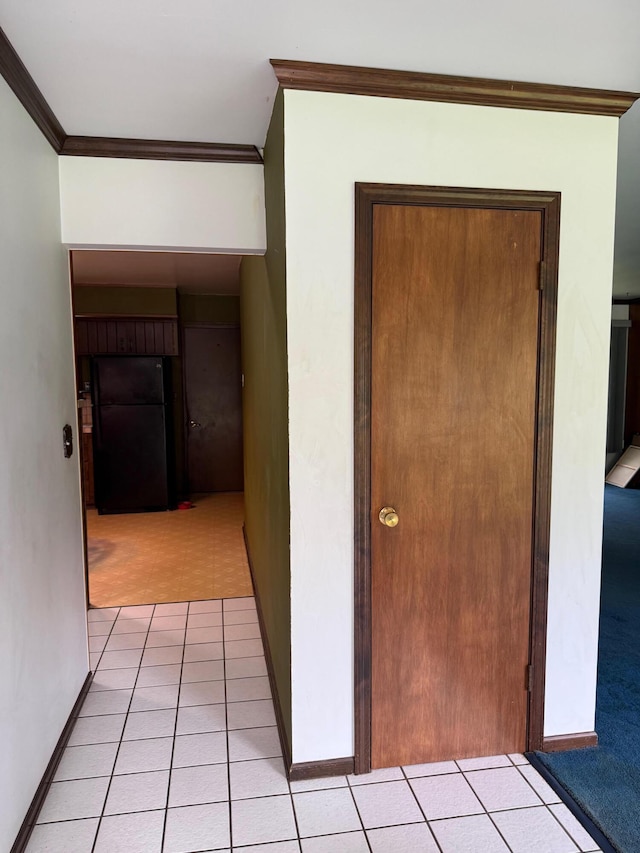 3104 Chippewa Hwy, Manistee, MI 49660 - corridor featuring ornamental molding, baseboards, and light tile patterned floors