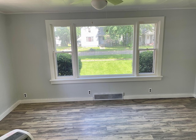 612 N Prospect St, Sturgis, MI 49091 - unfurnished dining area with ornamental molding, baseboards, and wood finished floors