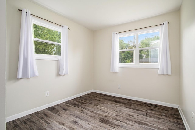 1246 Chalmers Dr, Battle Creek, MI 49015 - spare room featuring wood finished floors and baseboards