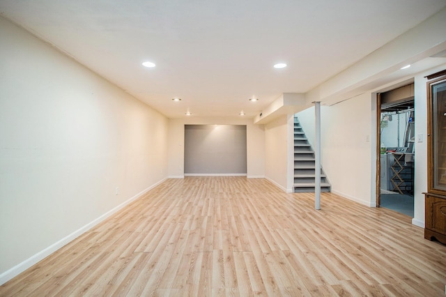 1246 Chalmers Dr, Battle Creek, MI 49015 - finished basement with stairway, baseboards, light wood finished floors, and recessed lighting