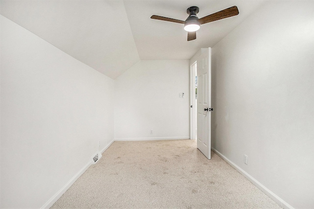 329 N Liberty St, Marshall, MI 49068 - spare room featuring light carpet, baseboards, lofted ceiling, and a ceiling fan