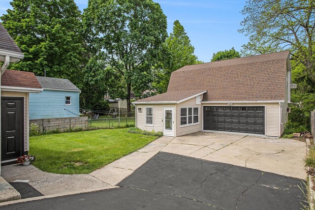 329 N Liberty St, Marshall, MI 49068 - view of yard featuring a garage