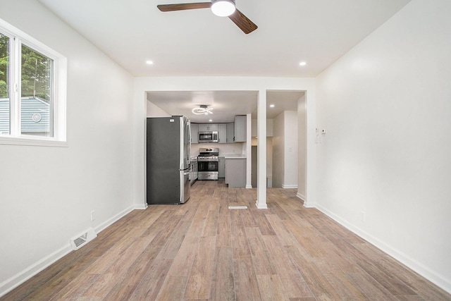 329 N Liberty St, Marshall, MI 49068 - unfurnished living room featuring light wood-style floors, ceiling fan, baseboards, and recessed lighting